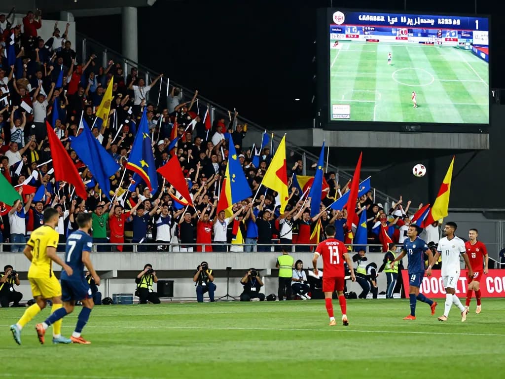 Exciting soccer match with fans, players, and live kết quả bóng đá updates in stadium.